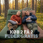 Par hviler på grøn og brun Luftmadras PRO V2 med grå puder i fyrreskov, med tilbudstekst om gratis puder